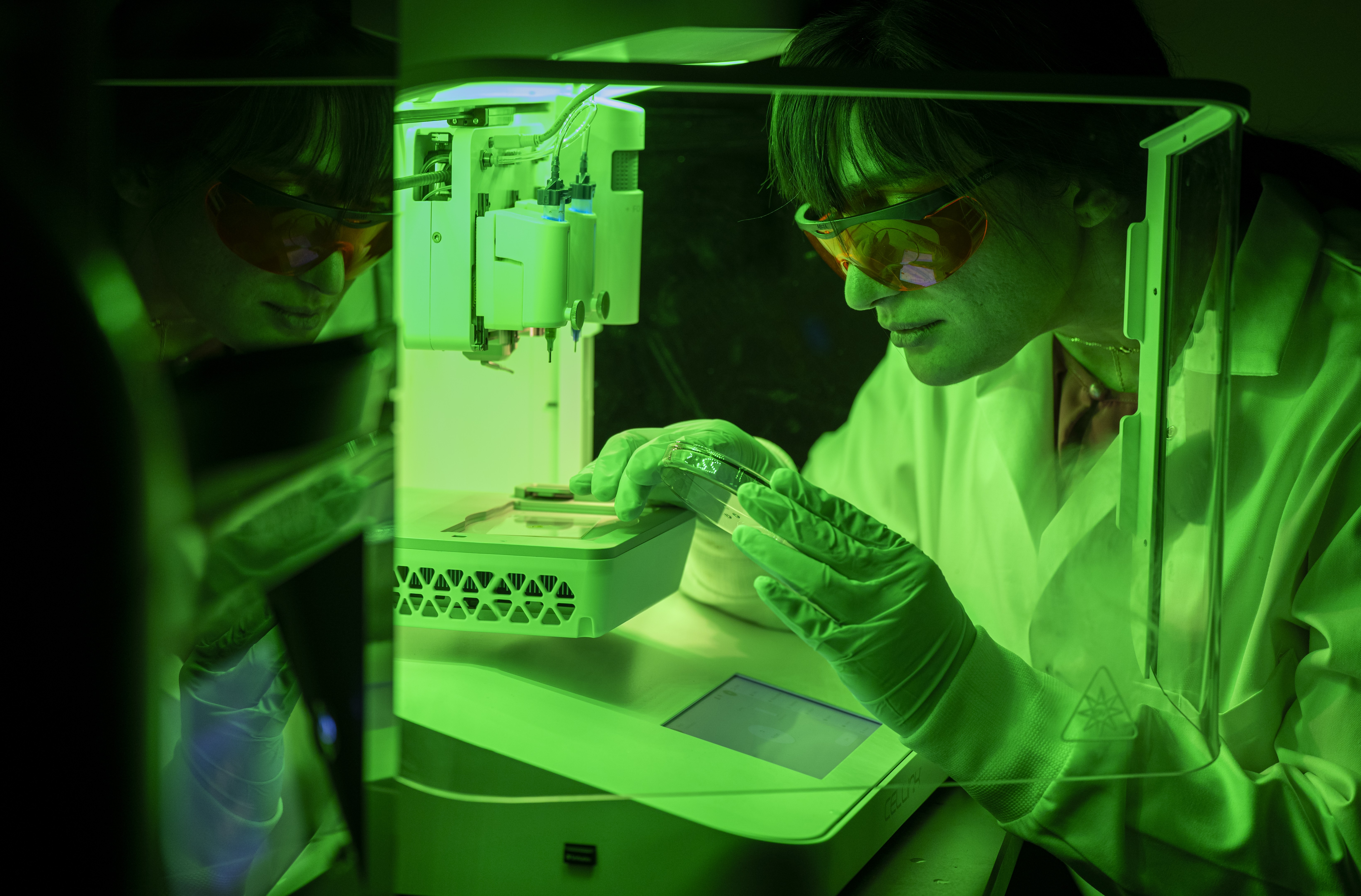 Dr. Fayyazbakhsh working with 3D printer